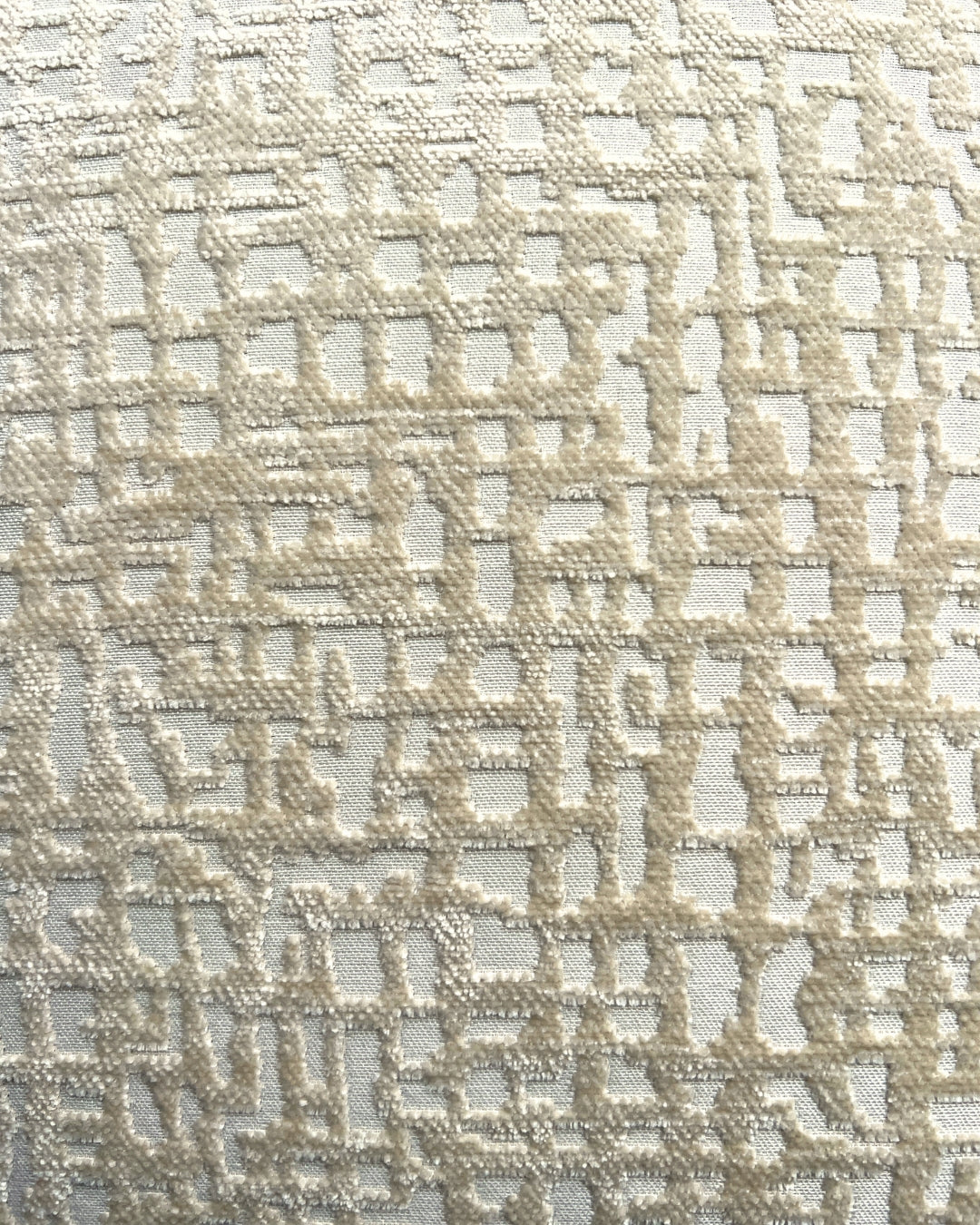 Crèmekleurig Hogaría interieur stof voor moderne en warme woonruimtes.